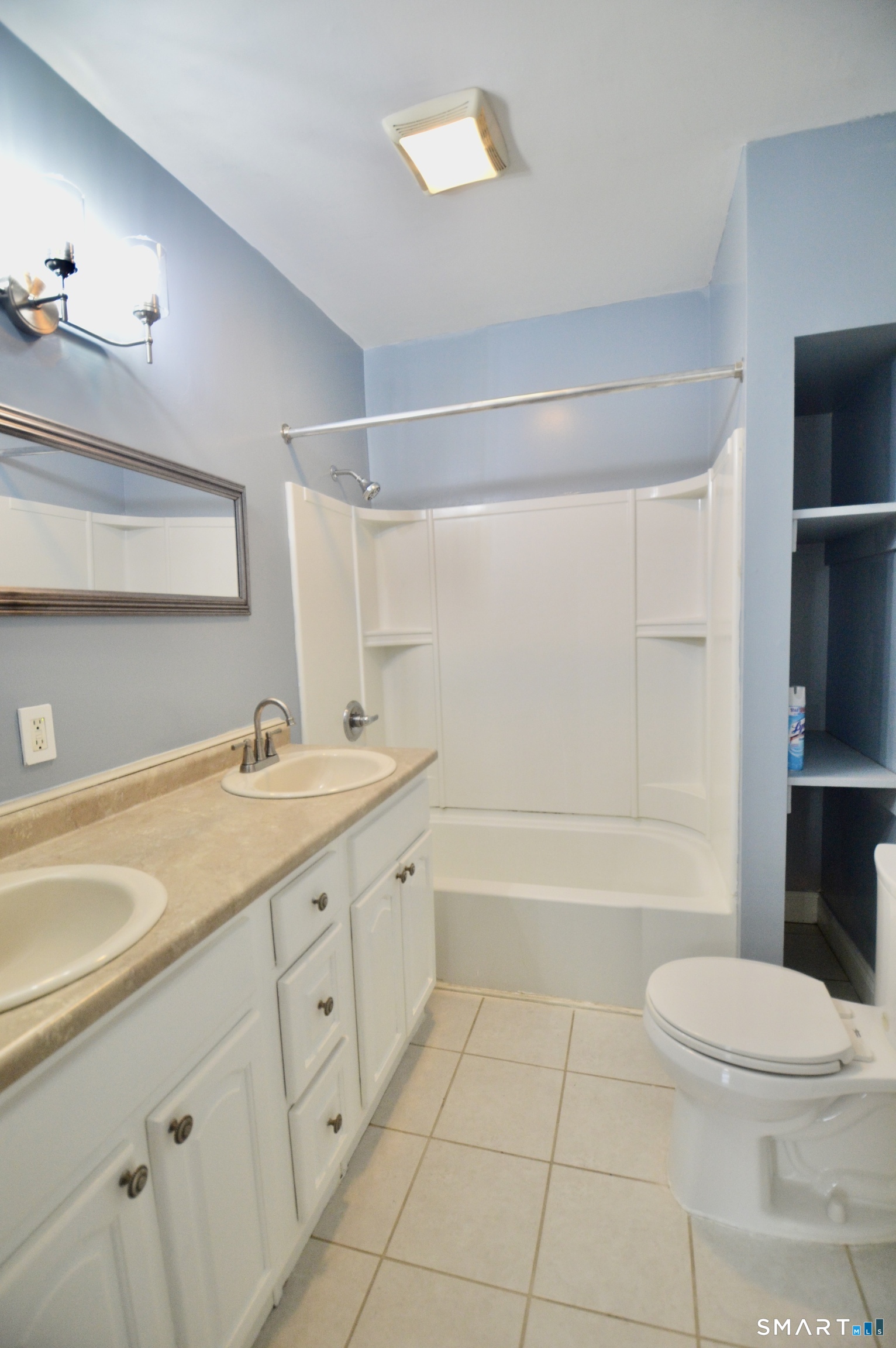 32 Boston Terrace Bridgeport, CT 06610 - Photo 13 of 14 a bathroom with a sink a toilet and bathtub