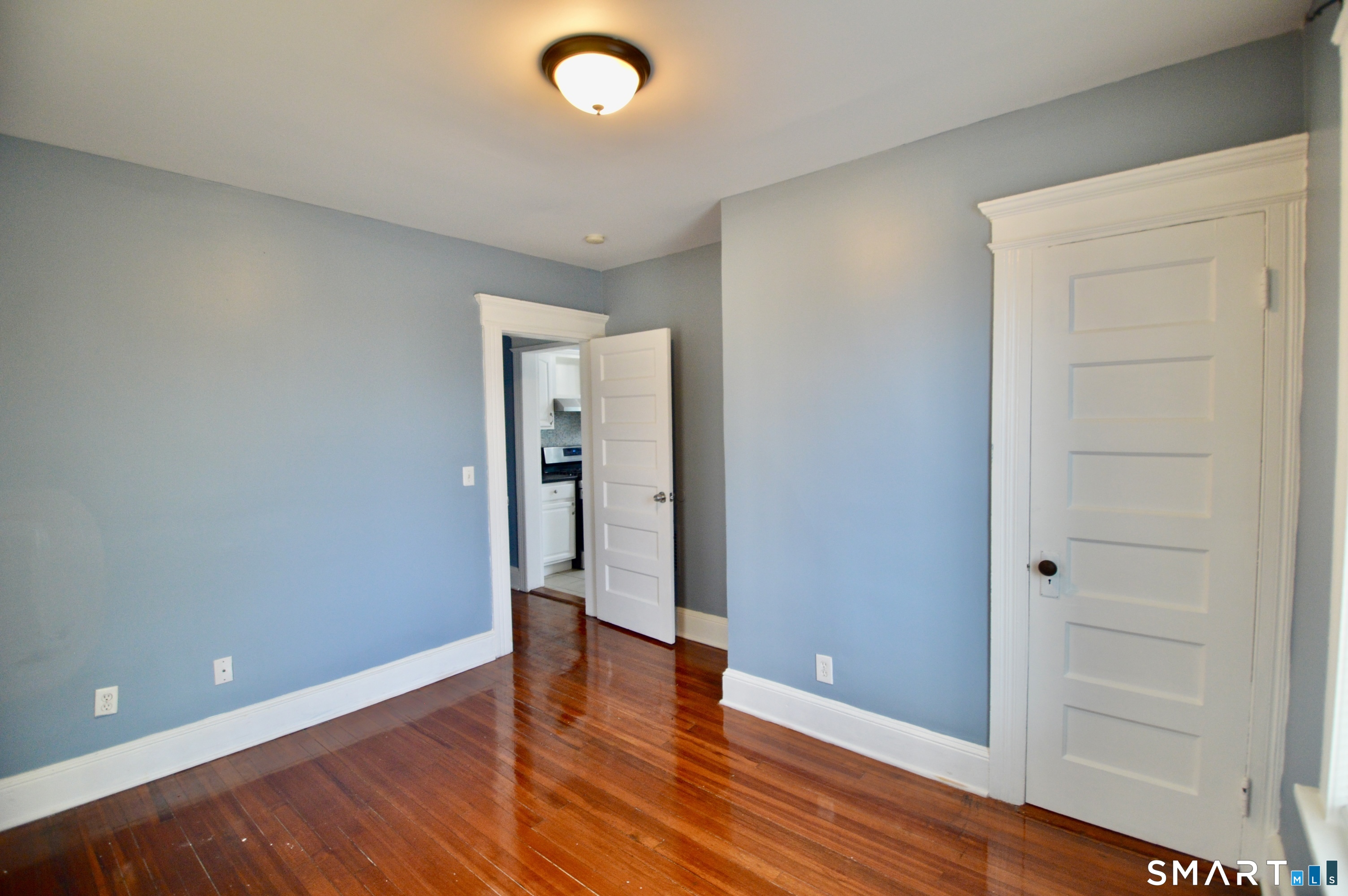 32 Boston Terrace Bridgeport, CT 06610 - Photo 10 of 14 wooden floor in an empty room