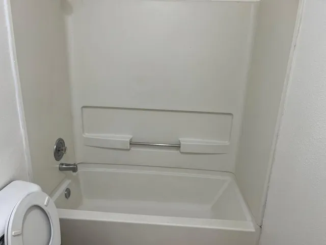 a close view of a bathtub in bathroom