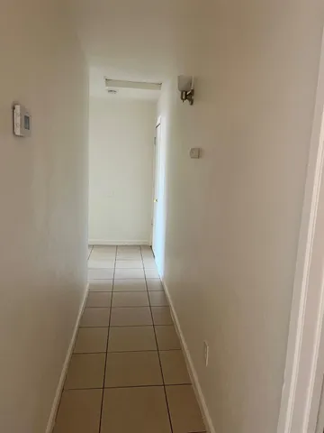 a view of hallway with shower