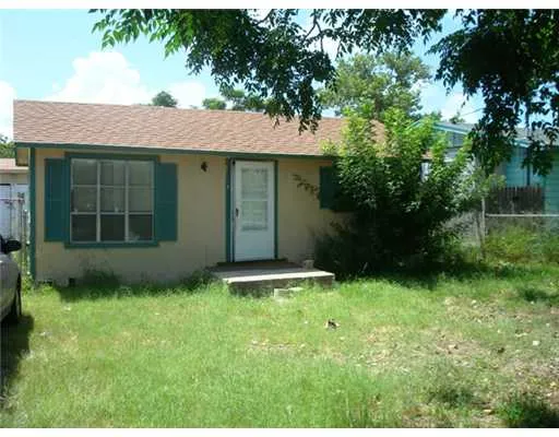 a view of an house with backyard space and garden