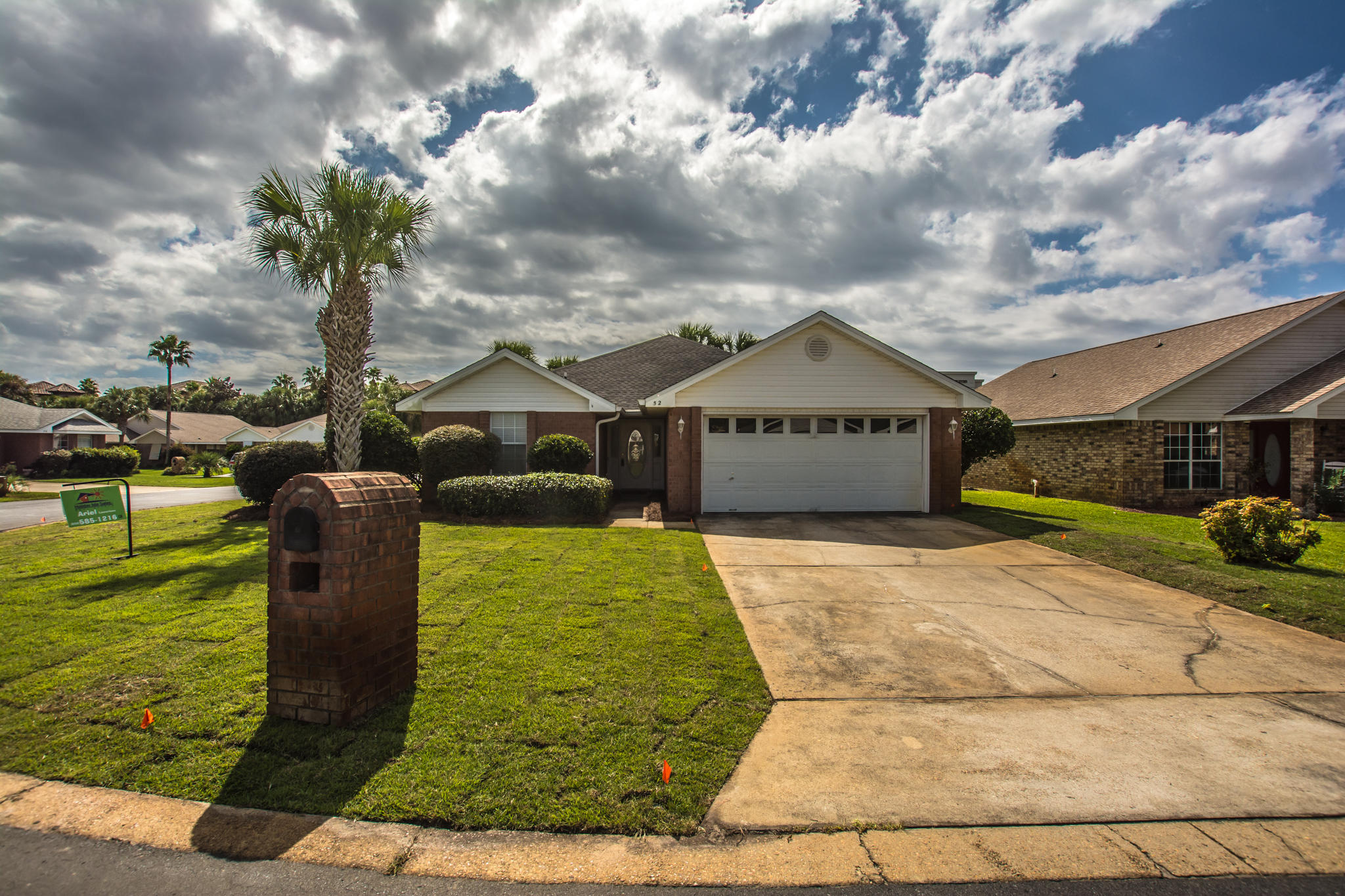 52 Green Island Way Miramar Beach, FL 32550 - Photo 1 of 27 a front view of a house with garden