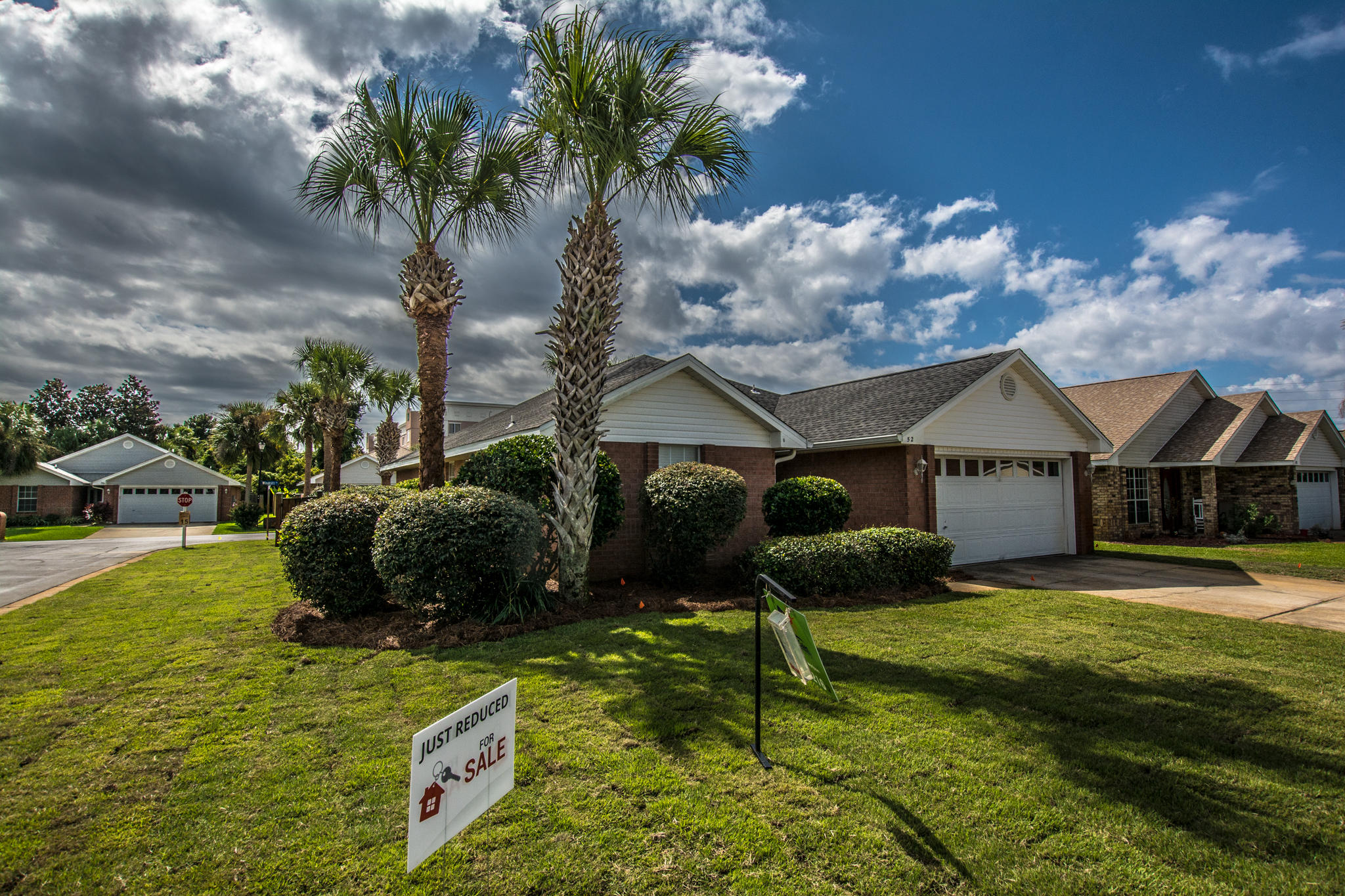 52 Green Island Way Miramar Beach, FL 32550 - Photo 2 of 27 a front view of a house with garden