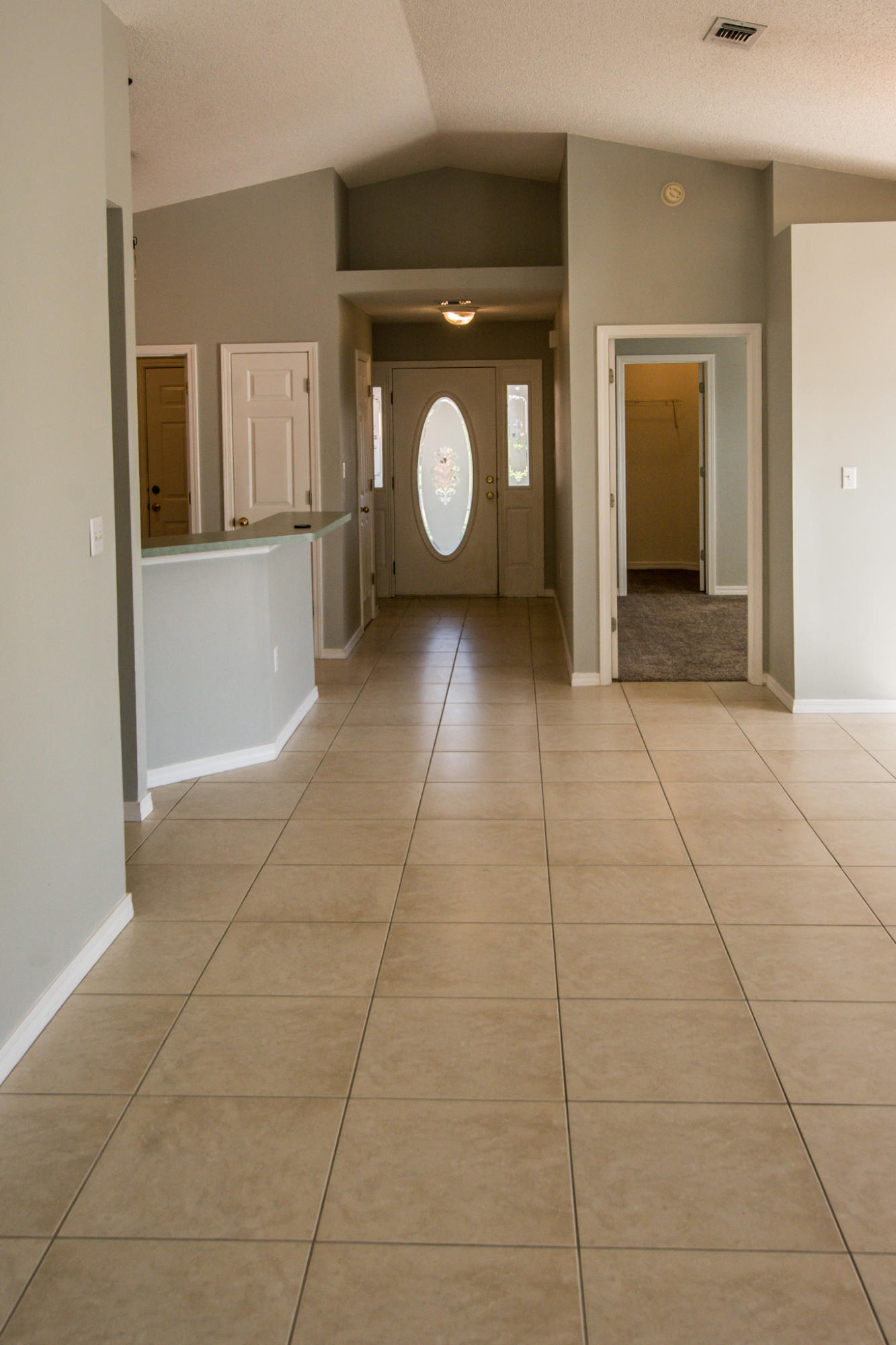 52 Green Island Way Miramar Beach, FL 32550 - Photo 9 of 27 a view of a refrigerator in kitchen and an empty room