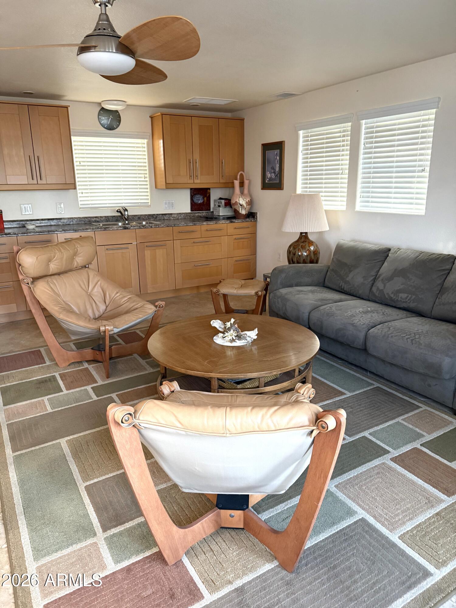 17200 West Bell Road, Unit 1784 Surprise, AZ 85374 - Photo 11 of 25 a living room with furniture and a table