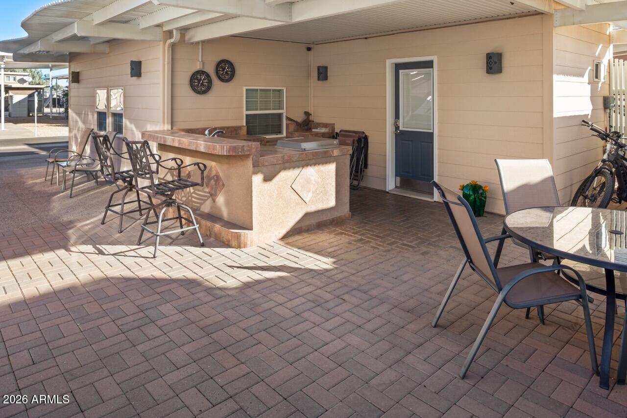 17200 West Bell Road, Unit 1784 Surprise, AZ 85374 - Photo 5 of 25 a living room with furniture and a wooden floor