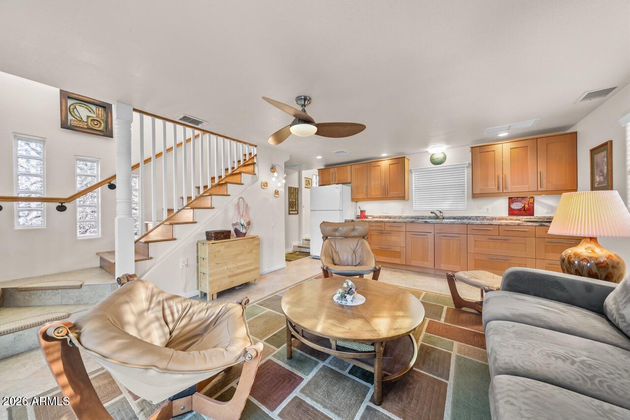 17200 West Bell Road, Unit 1784 Surprise, AZ 85374 - Photo 7 of 25 a living room with furniture and kitchen view