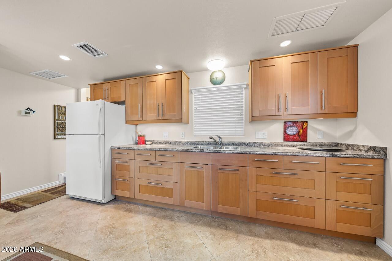 17200 West Bell Road, Unit 1784 Surprise, AZ 85374 - Photo 10 of 25 a kitchen with granite countertop cabinets stainless steel appliances and a sink