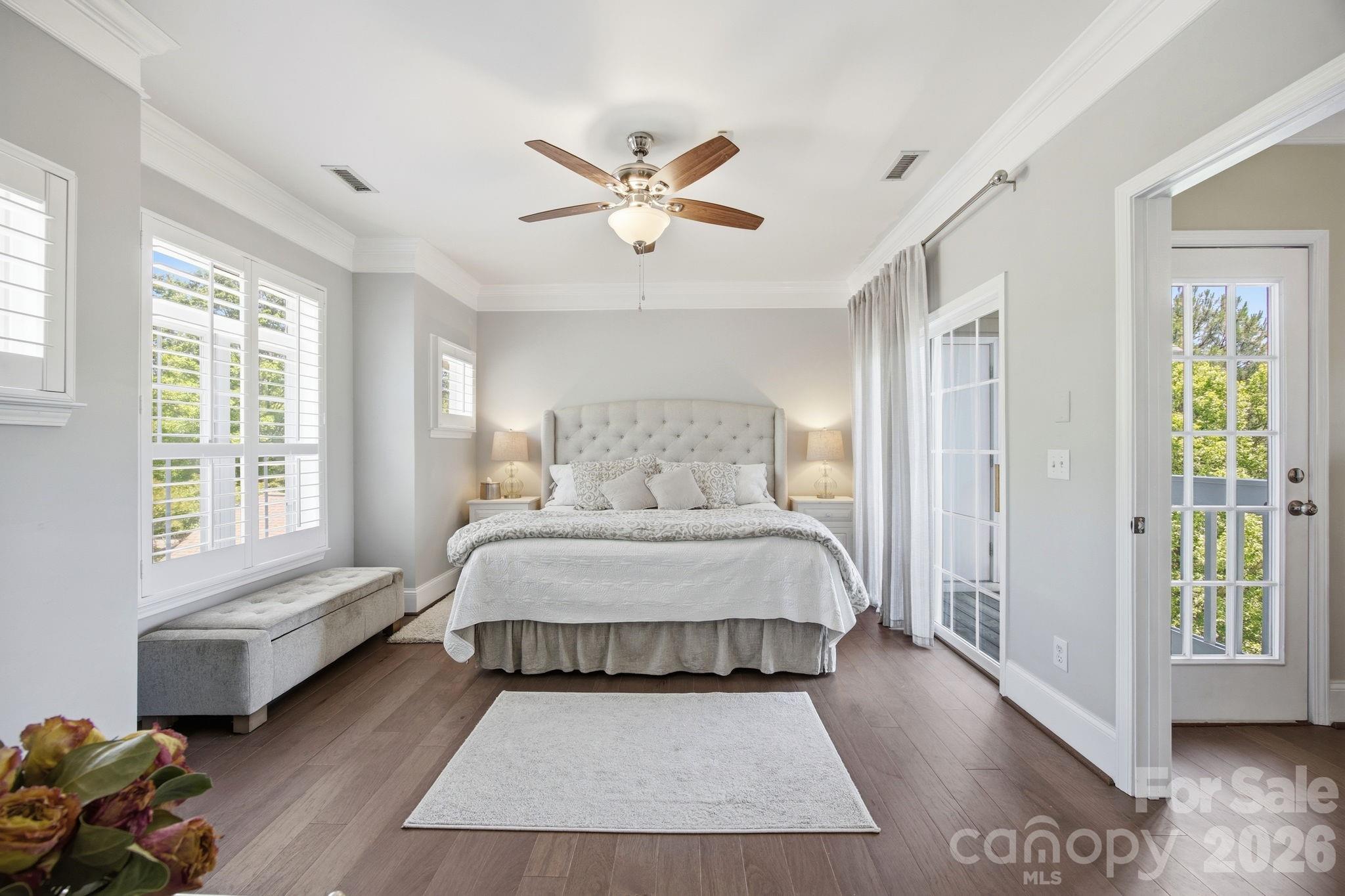 8942 Rosalyn Glen Road Cornelius, NC 28031 - Photo 20 of 47 a spacious bedroom with a bed and glass window
