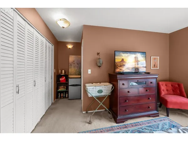 a room with a furniture and a dresser