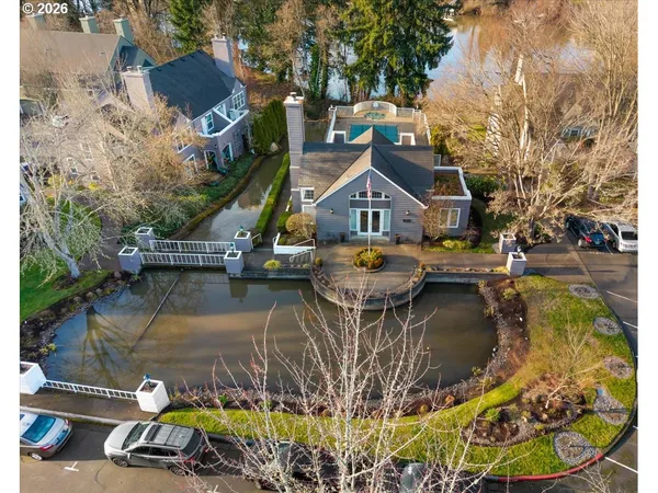 a view of a lake with a house in the background
