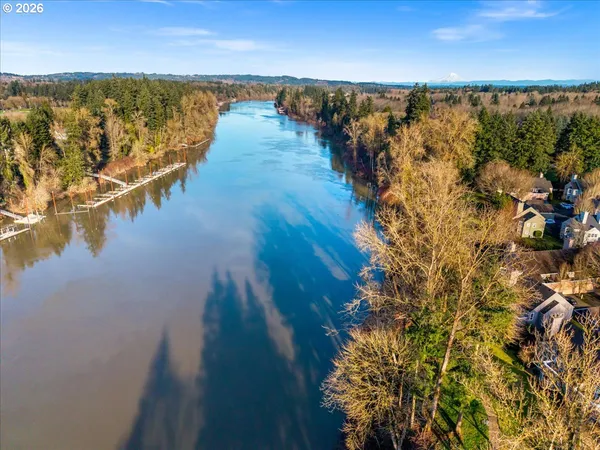 a view of residential houses with outdoor space and lake view