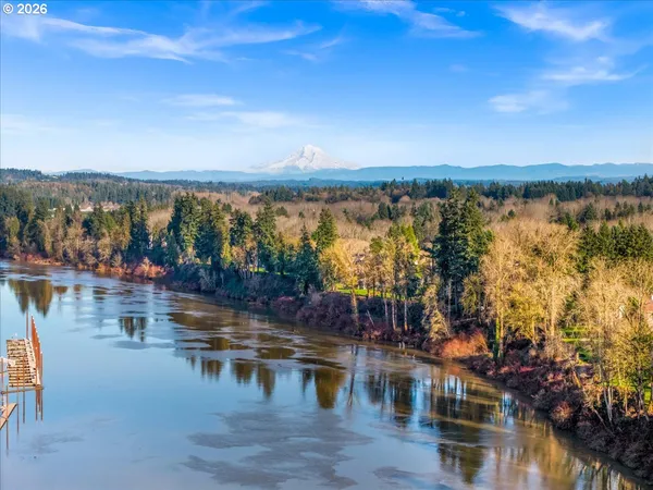 a view of a wooden fence and a back yard