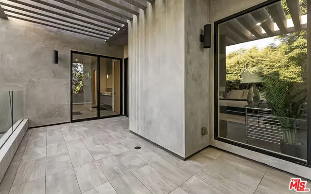 a view of a porch with wooden floor