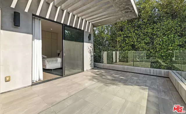 a view of a porch with wooden floor and fence