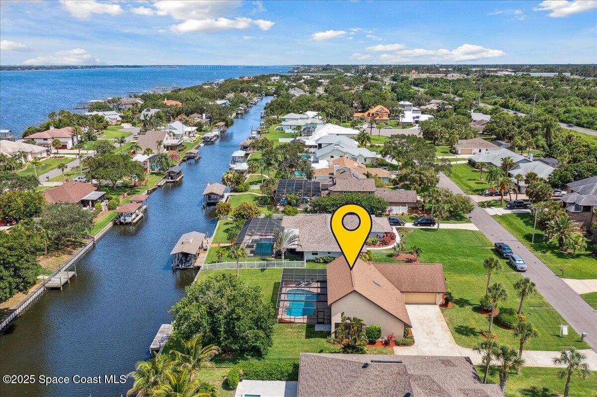 6315 Anchor Lane Rockledge, FL 32955 - Photo 1 of 52 an aerial view of residential houses with outdoor space and swimming pool
