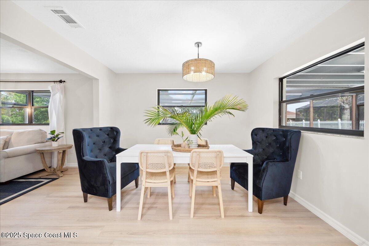 6315 Anchor Lane Rockledge, FL 32955 - Photo 11 of 52 a view of a dining room with furniture window and outside view