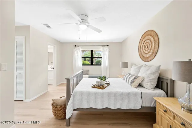 a bedroom with bed and a window