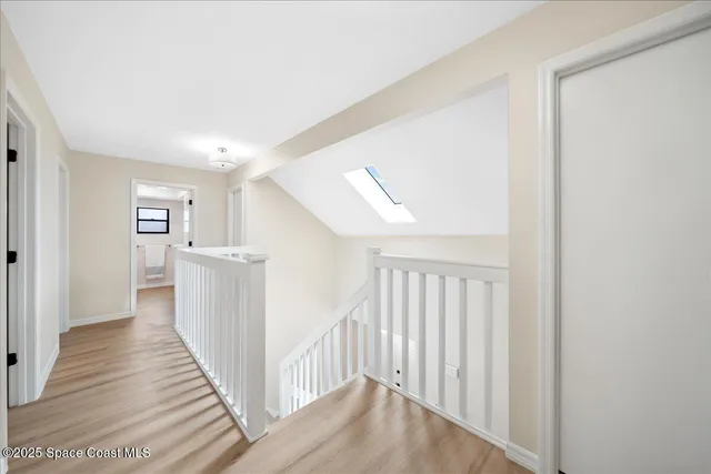 a view of a living room and a wooden floor
