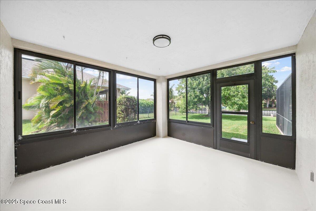 6315 Anchor Lane Rockledge, FL 32955 - Photo 42 of 52 a view of an empty room with large windows