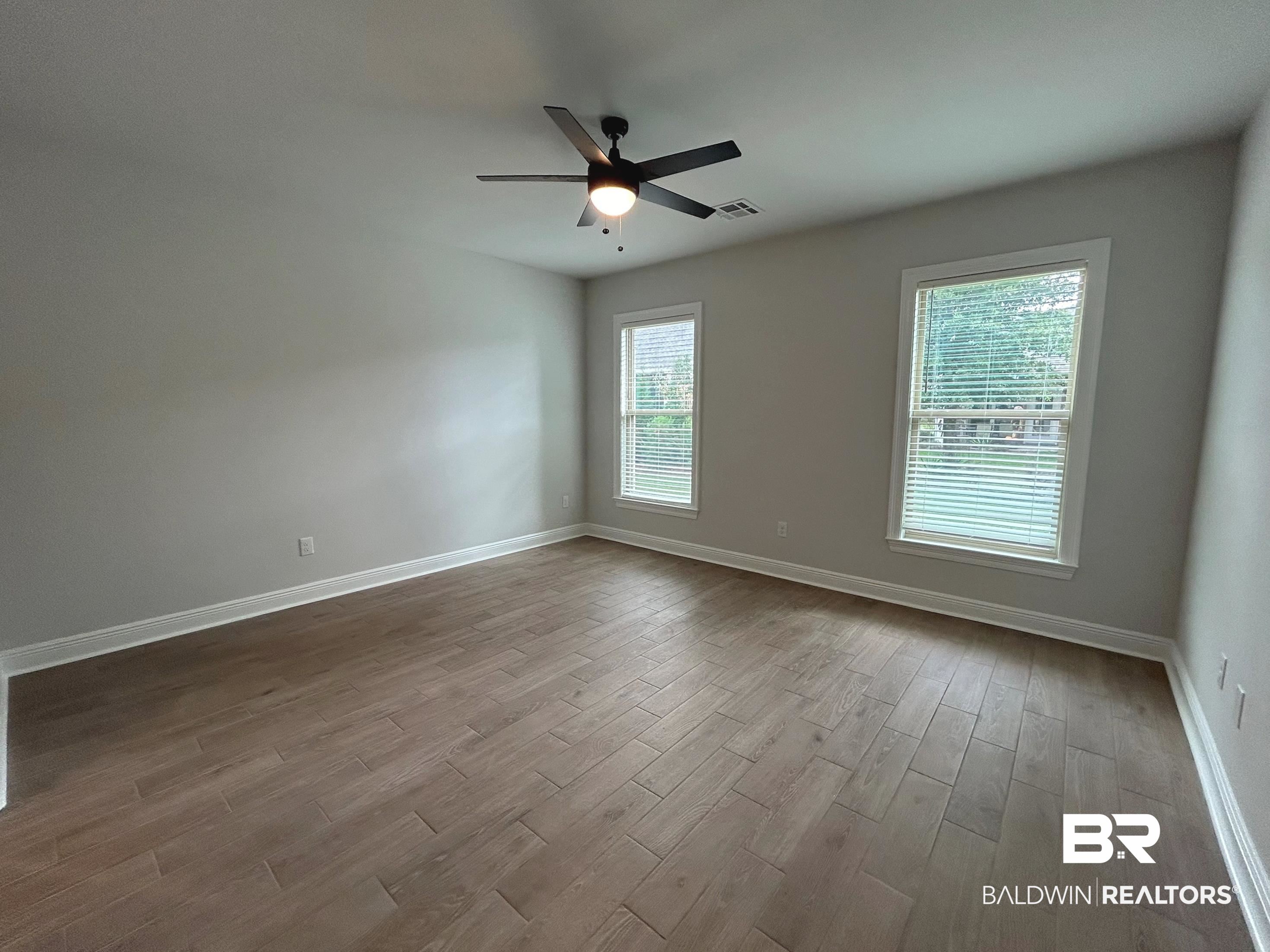 860 Sumter Loop Foley, AL 36535 - Photo 12 of 26 Unfurnished room with ceiling fan and light hardwood / wood-style flooring