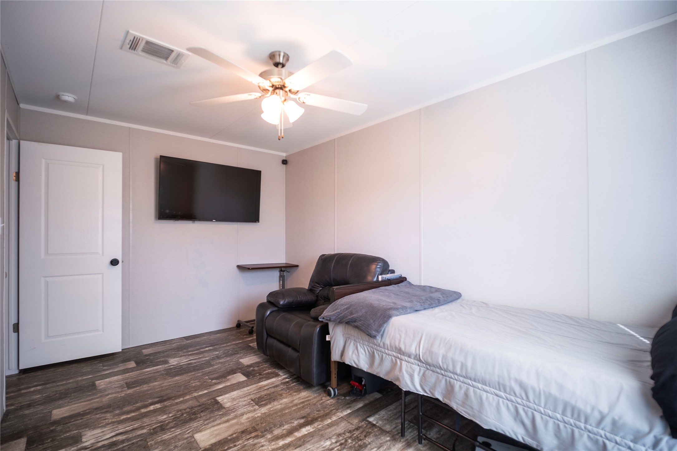5402 Five Oaks Drive Spring, TX 77389 - Photo 14 of 20 a bedroom with a bed and a flat screen tv