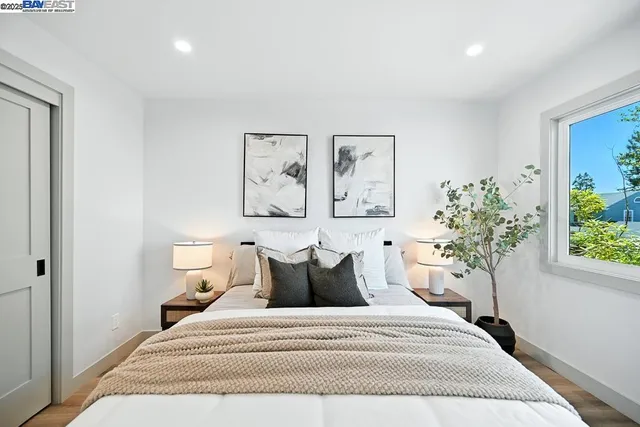 a bedroom with a bed and a couch