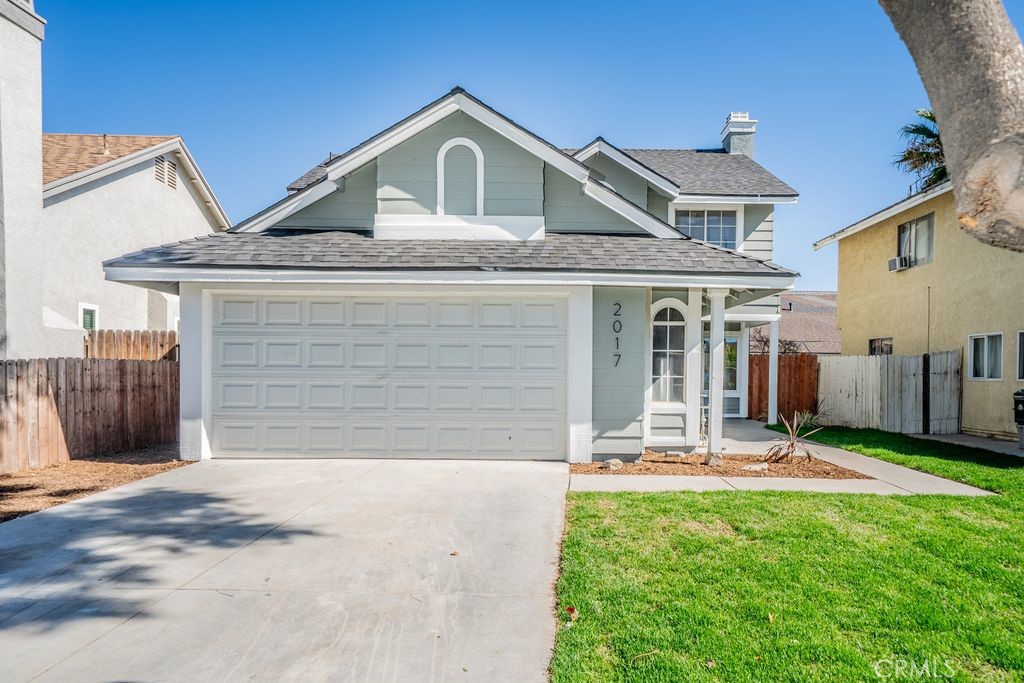 2017 Cherrytree Drive Perris, CA 92571 - Photo 20 of 20 a front view of a house with a yard
