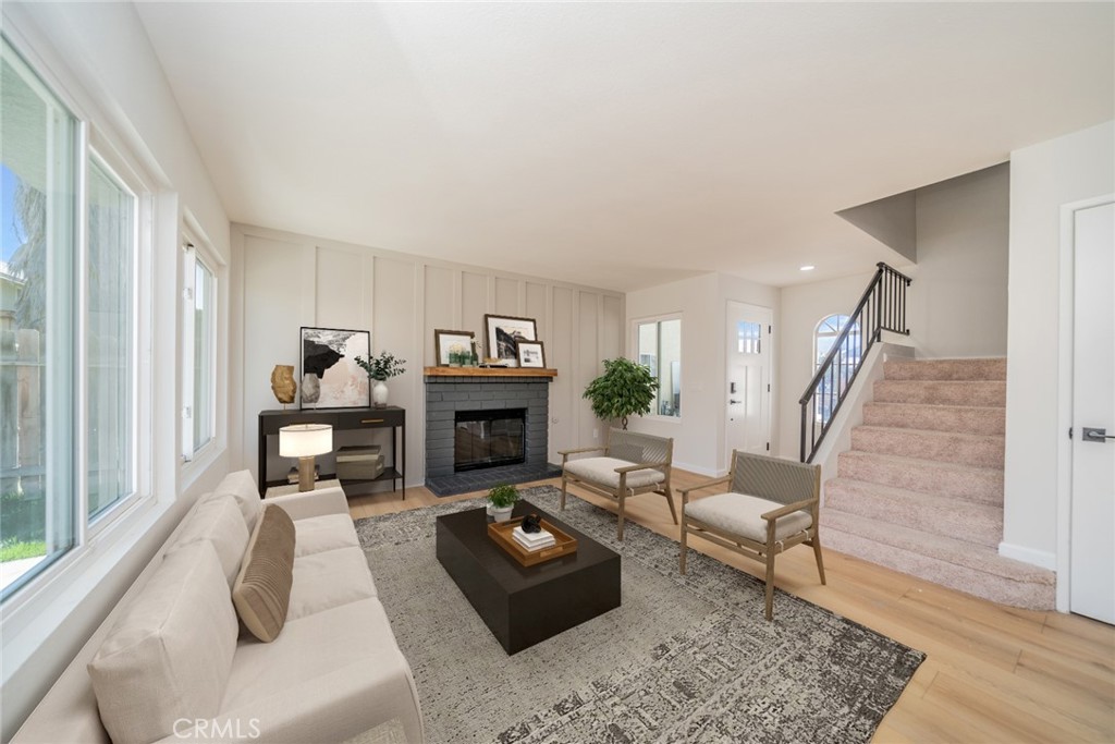 2017 Cherrytree Drive Perris, CA 92571 - Photo 2 of 20 a living room with furniture and a fireplace