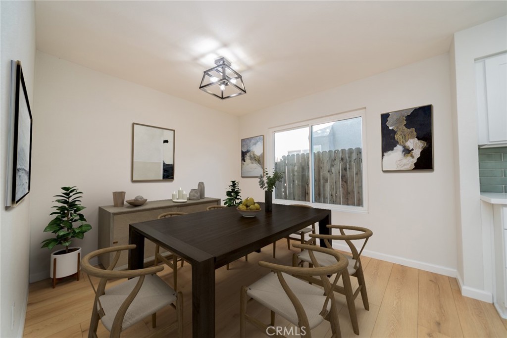 2017 Cherrytree Drive Perris, CA 92571 - Photo 4 of 20 a view of a dining room with furniture window and wooden floor