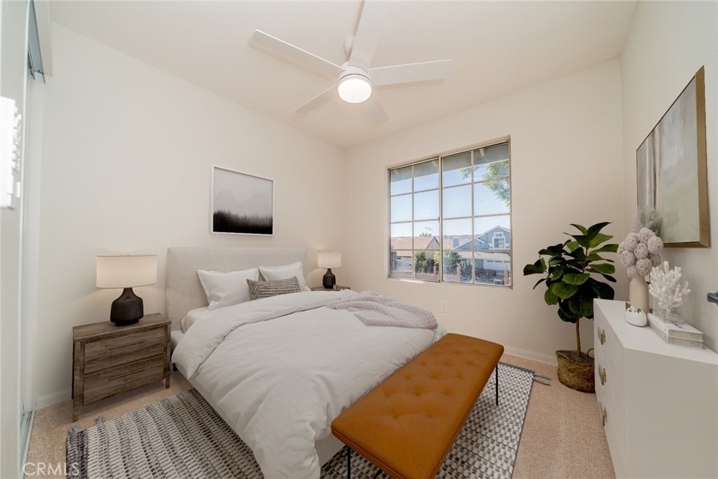 2017 Cherrytree Drive Perris, CA 92571 - Photo 7 of 20 a bedroom with a bed and a couch