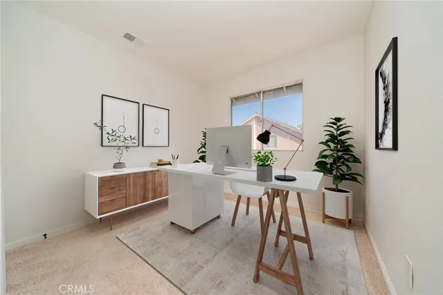 a workspace with furniture and window