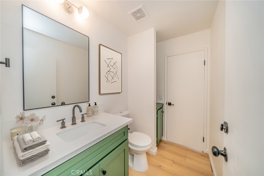 2017 Cherrytree Drive Perris, CA 92571 - Photo 10 of 20 a bathroom with a granite countertop sink mirror and toilet