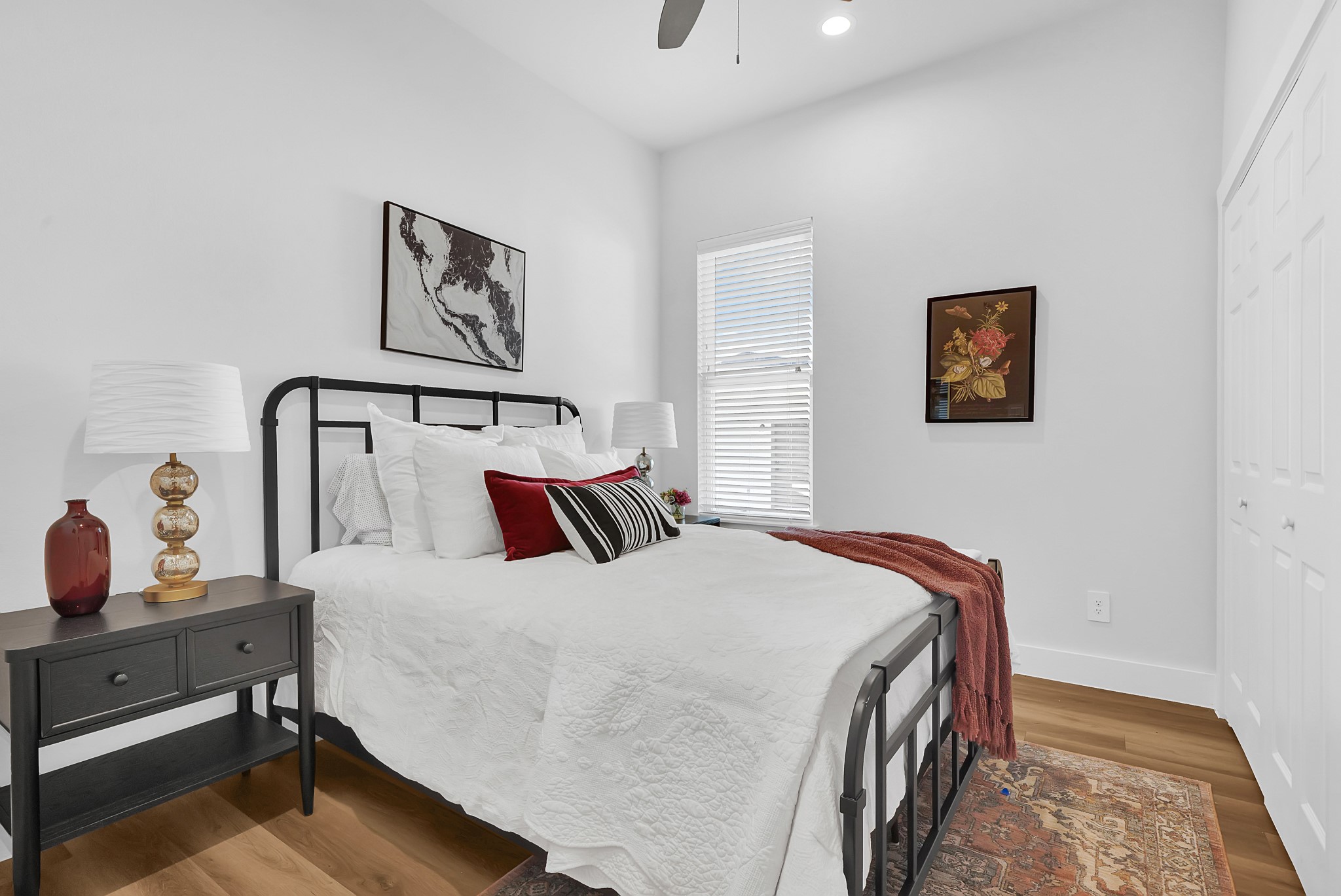 38634 Spur 149 Road, Unit 22A Magnolia, TX 77354 - Photo 15 of 48 a bedroom with a bed and painting on the wall