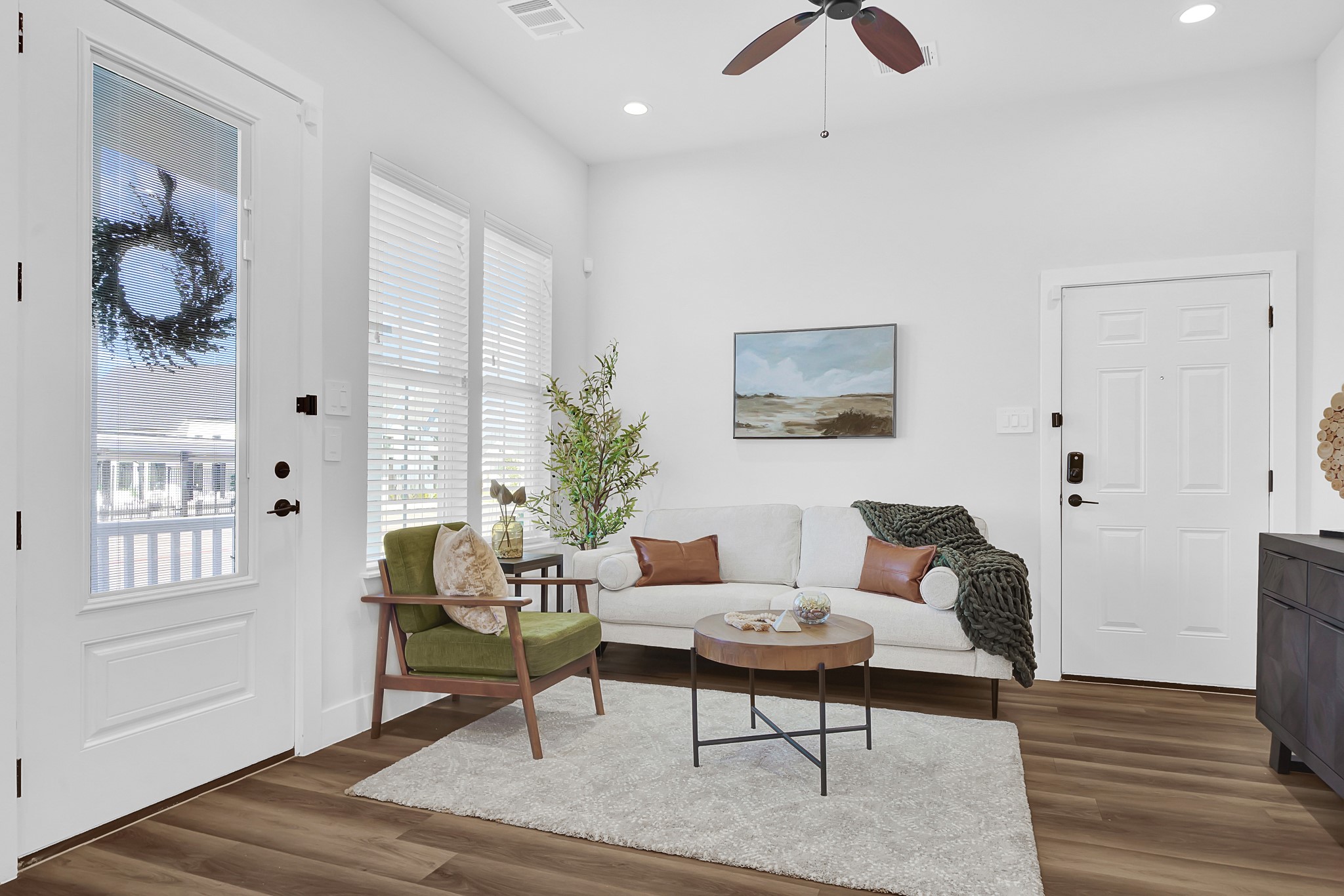 38634 Spur 149 Road, Unit 22A Magnolia, TX 77354 - Photo 5 of 48 a living room with furniture and wooden floor