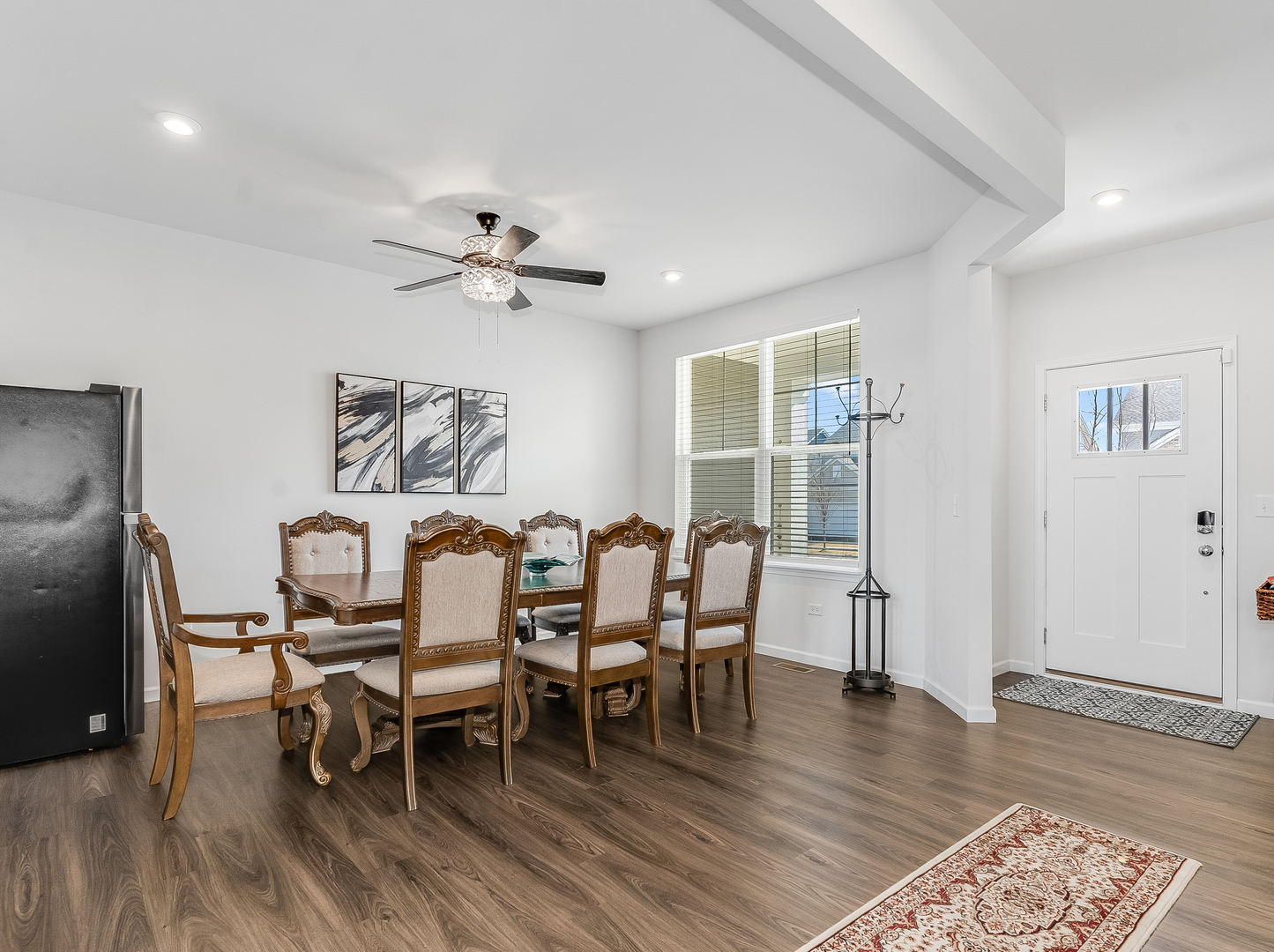 2552 Weatherbee Lane Naperville, IL 60563 - Photo 17 of 43 a dining room with furniture a chandelier and wooden floor