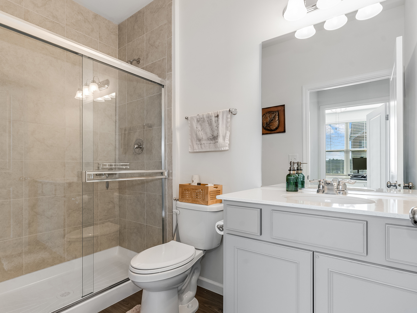 2552 Weatherbee Lane Naperville, IL 60563 - Photo 20 of 43 a bathroom with a sink a toilet and a large mirror