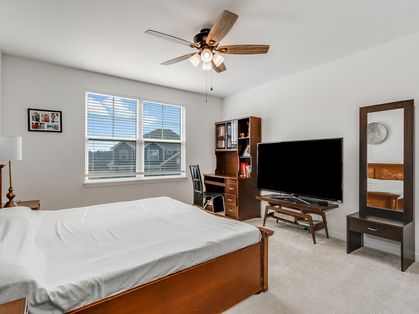2552 Weatherbee Lane Naperville, IL 60563 - Photo 25 of 43 a bedroom with a bed and a flat screen tv