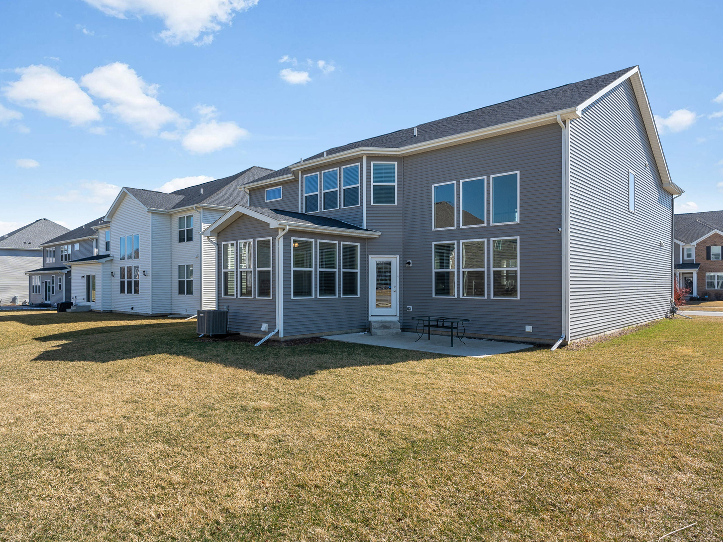 2552 Weatherbee Lane Naperville, IL 60563 - Photo 35 of 43 a view of a house with a swimming pool