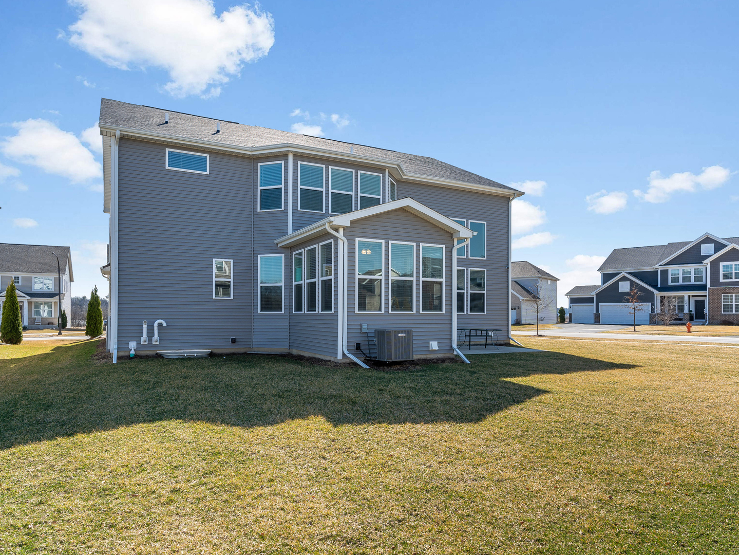 2552 Weatherbee Lane Naperville, IL 60563 - Photo 36 of 43 a view of a house with a yard and swimming pool