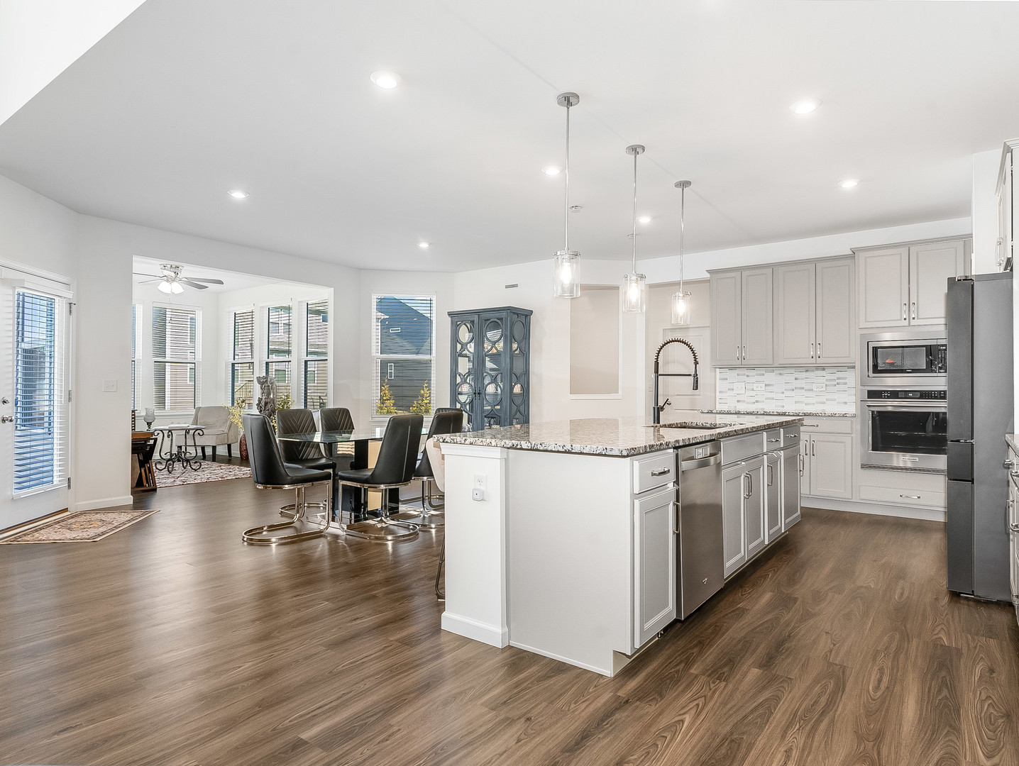 2552 Weatherbee Lane Naperville, IL 60563 - Photo 9 of 43 a kitchen with stove and wooden floor