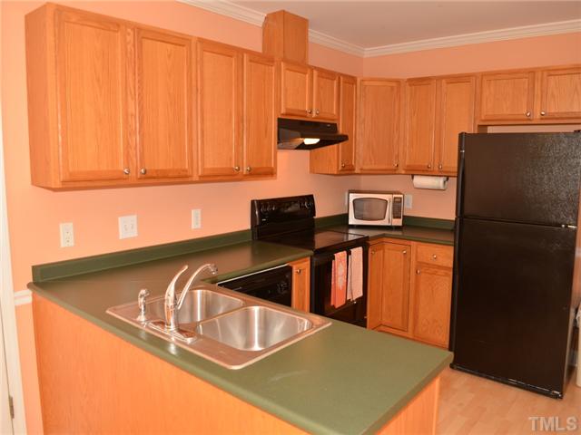4212 Archibald Way Raleigh, NC 27616 - Photo 5 of 21 Another view of this spacious kitchen. Laminate flooring throughout.