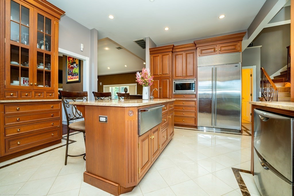 93 Narrows Road Assonet, MA 02702 - Photo 12 of 42 a kitchen with stainless steel appliances granite countertop a refrigerator a oven and a stove