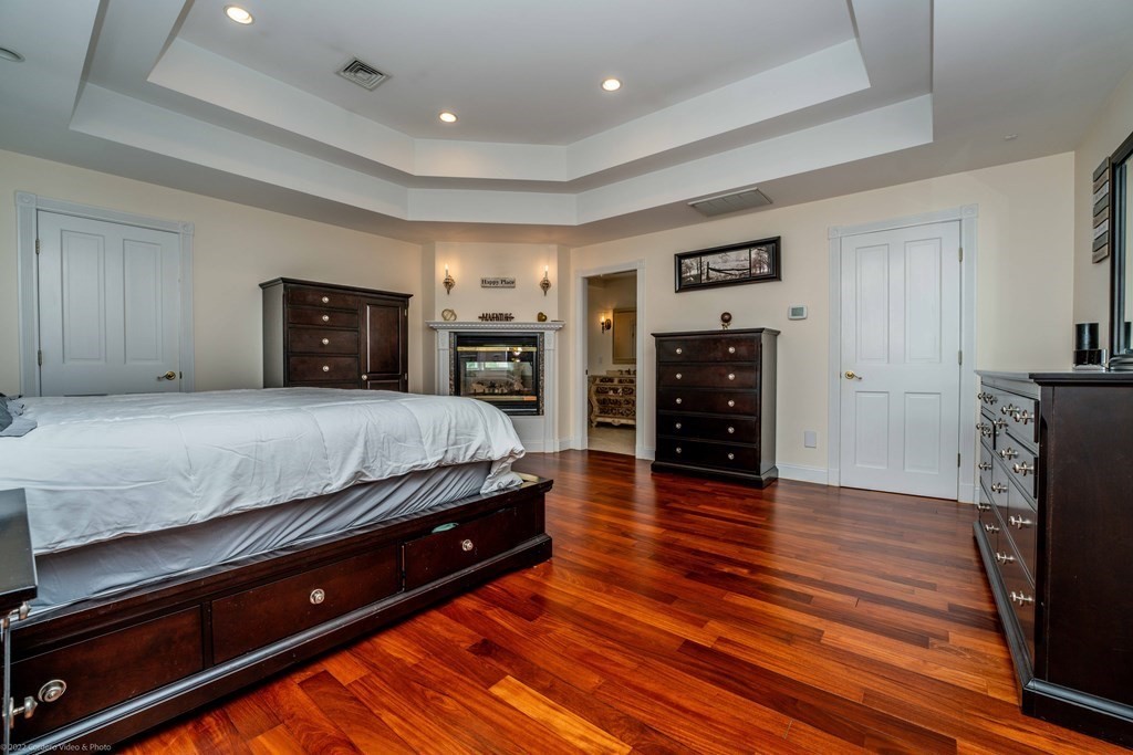 93 Narrows Road Assonet, MA 02702 - Photo 24 of 42 a spacious bedroom with a bed and a television