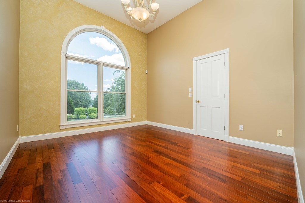 93 Narrows Road Assonet, MA 02702 - Photo 28 of 42 an empty room with wooden floor and windows