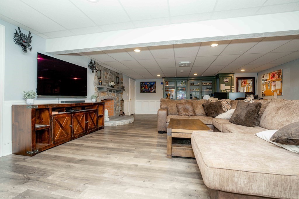 93 Narrows Road Assonet, MA 02702 - Photo 37 of 42 a living room with furniture and a flat screen tv