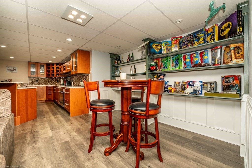 93 Narrows Road Assonet, MA 02702 - Photo 41 of 42 a open kitchen with stainless steel appliances granite countertop a sink and a refrigerator