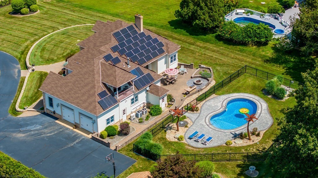 93 Narrows Road Assonet, MA 02702 - Photo 7 of 42 an aerial view of a house a yard and outdoor seating