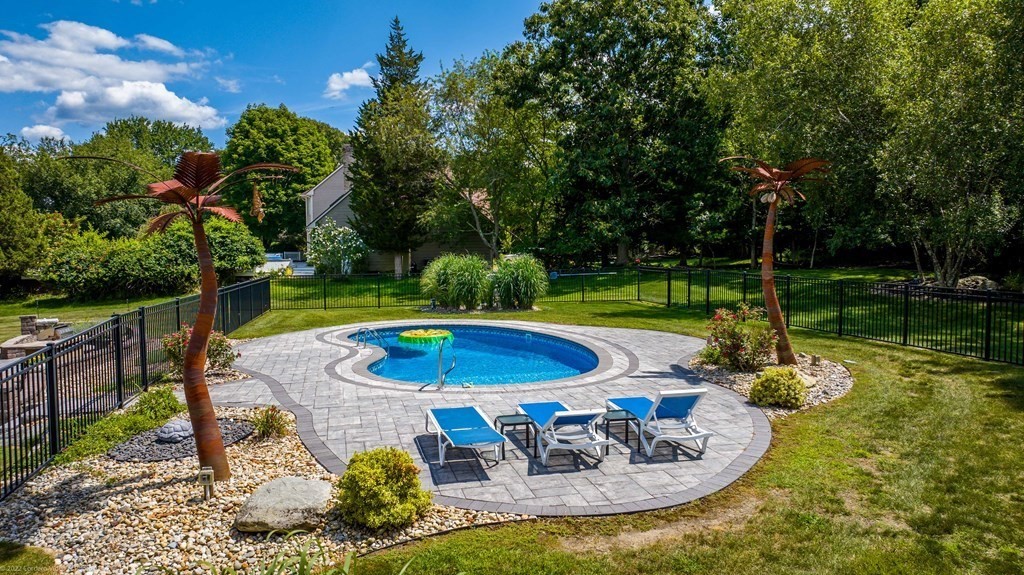 93 Narrows Road Assonet, MA 02702 - Photo 8 of 42 a view of a swimming pool with a patio
