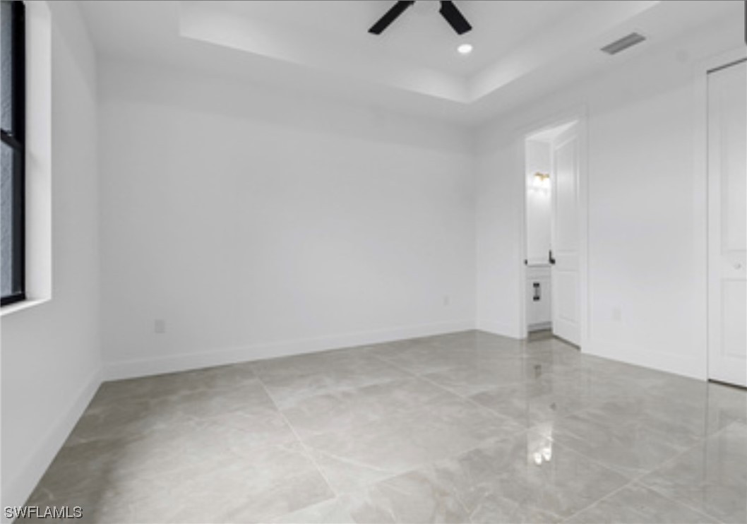 2607 4th Street Southwest Lehigh Acres, FL 33976 - Photo 13 of 21 an empty room with fan and window